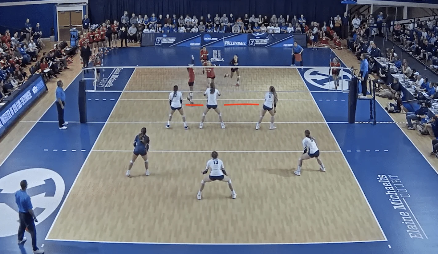an image of a team blocking in volleyball